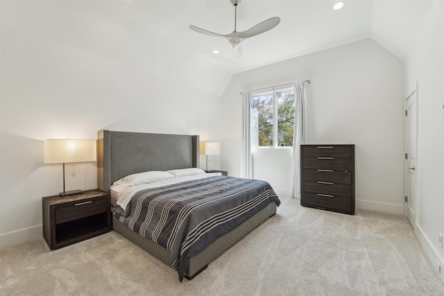 bedroom featuring vaulted ceiling, baseboards, and light carpet