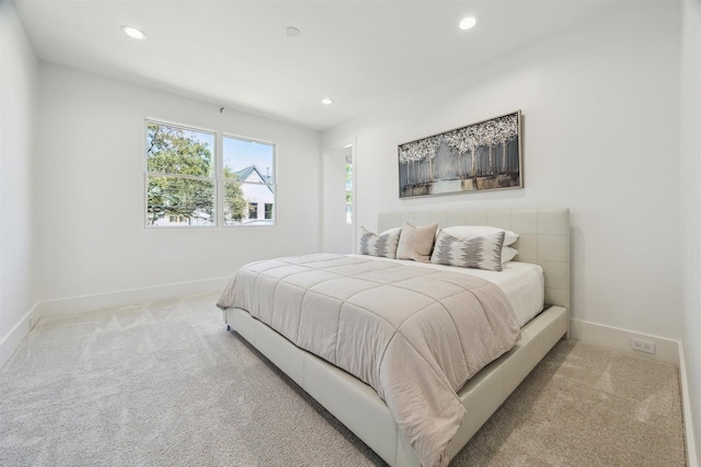 carpeted bedroom with recessed lighting and baseboards