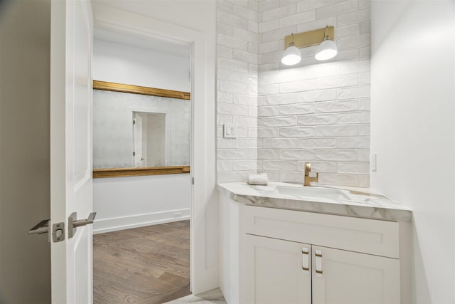 bathroom featuring vanity and wood finished floors