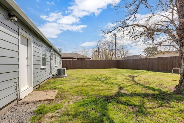 view of yard featuring cooling unit and a fenced backyard