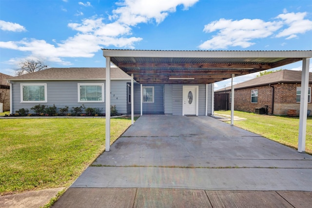 single story home featuring a carport, concrete driveway, and a front lawn