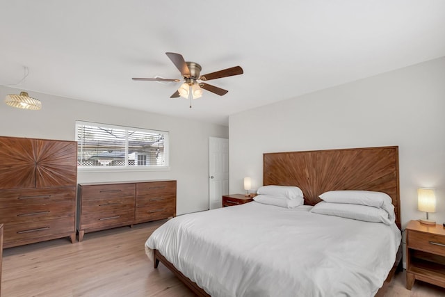 bedroom featuring light wood-style flooring and ceiling fan