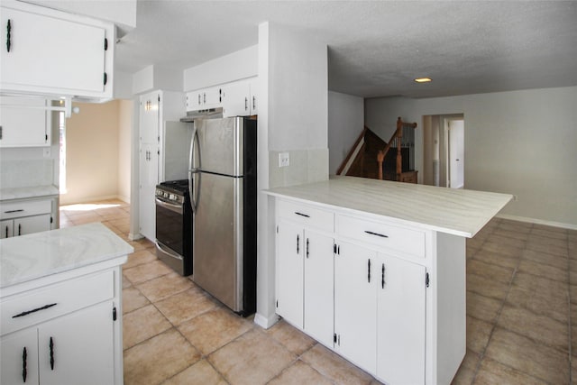 kitchen with stainless steel appliances, white cabinetry, a peninsula, and light countertops