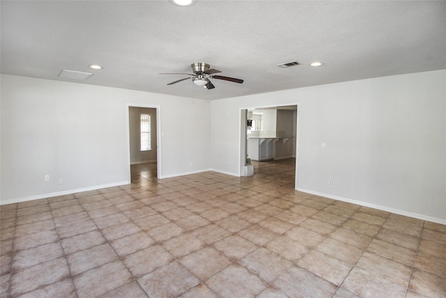 unfurnished room with a ceiling fan, recessed lighting, baseboards, and visible vents