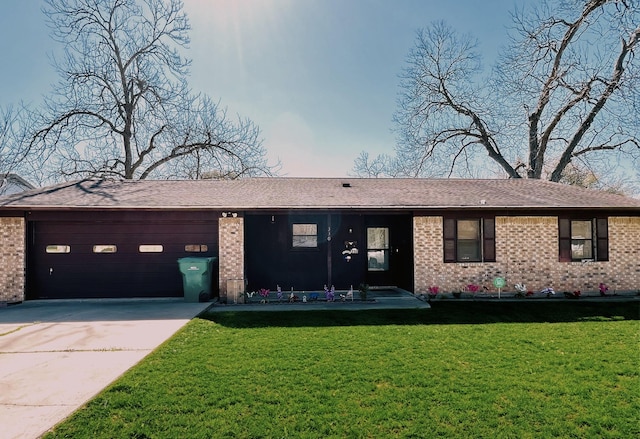 single story home with brick siding, concrete driveway, a front yard, and a garage