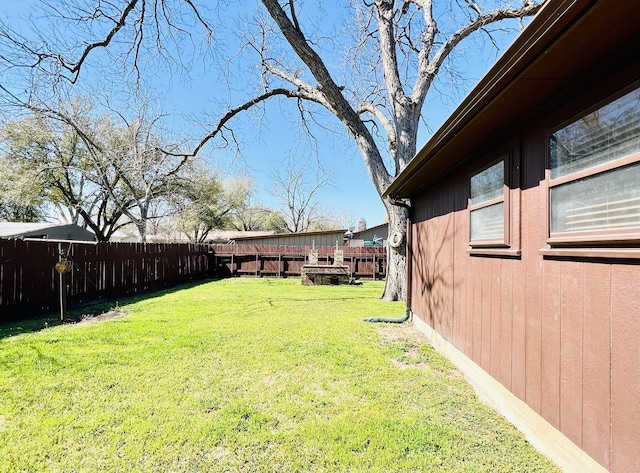 view of yard with a fenced backyard