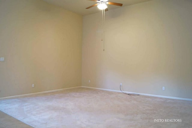 empty room with baseboards and ceiling fan