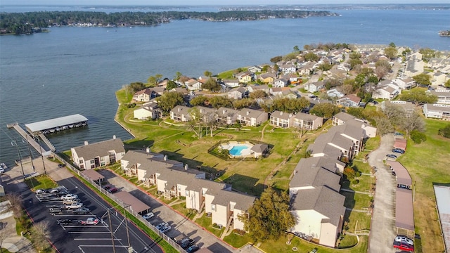 drone / aerial view with a residential view and a water view