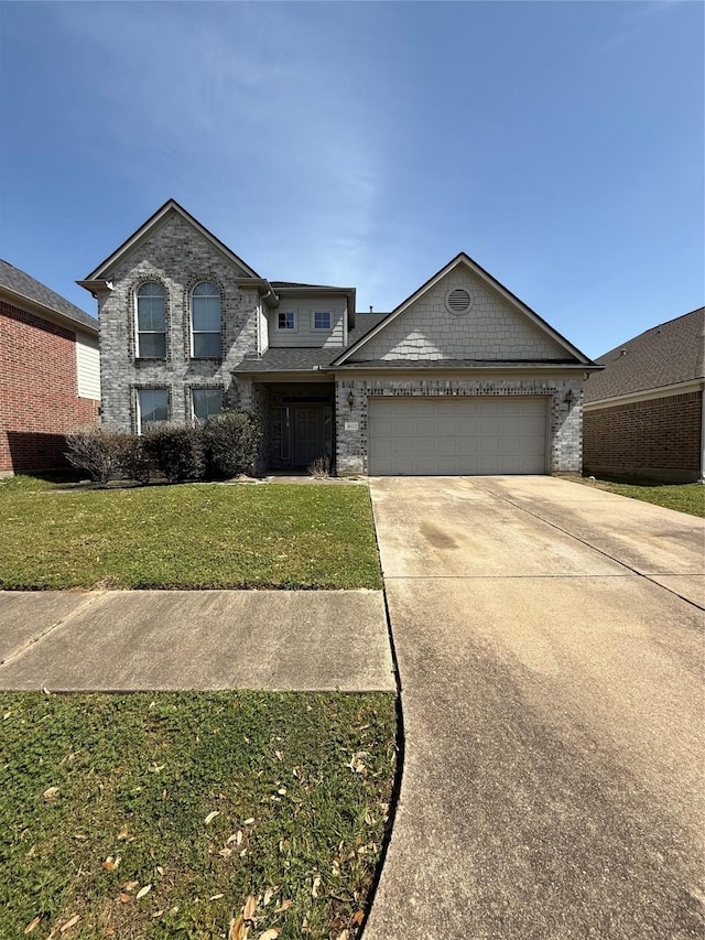 traditional-style house with brick siding, a front lawn, an attached garage, and driveway