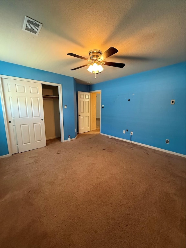 unfurnished bedroom featuring baseboards, visible vents, a closet, and a textured ceiling