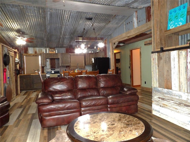12830 Fm 1280, Lovelady, TX 75851 - living room featuring a ceiling fan, vaulted ceiling, and wood finished floors