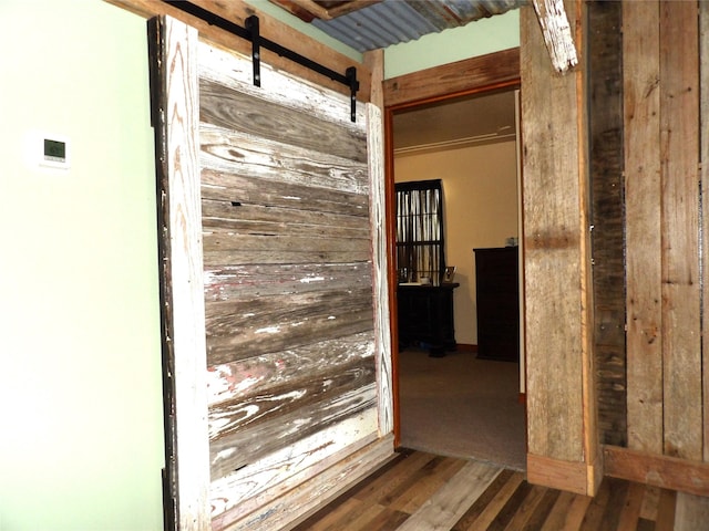 12830 Fm 1280, Lovelady, TX 75851 - hallway with a barn door and wood finished floors