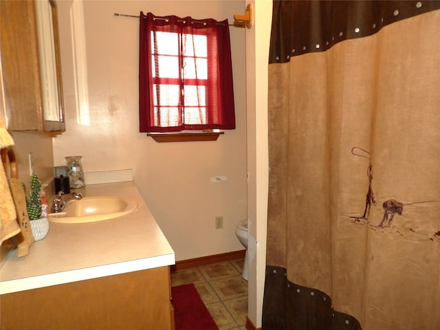 12830 Fm 1280, Lovelady, TX 75851 - bathroom featuring vanity, toilet, and baseboards