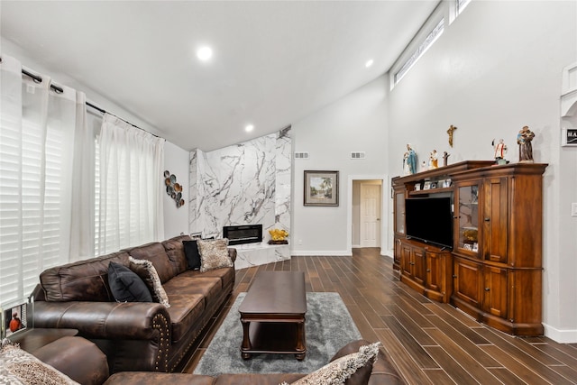 living room featuring visible vents, recessed lighting, a fireplace, and wood finish floors