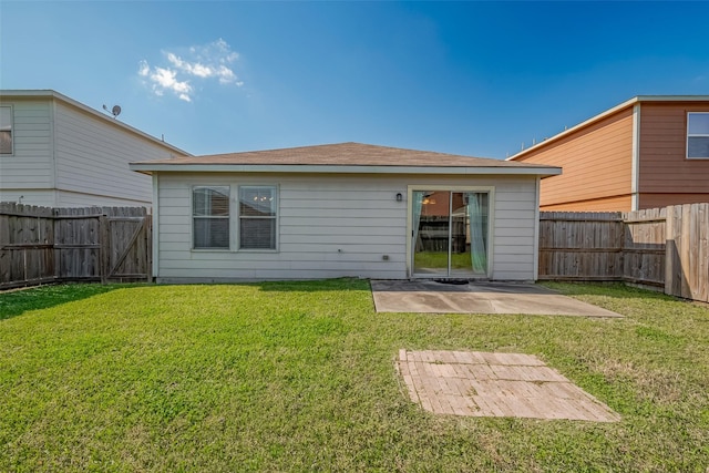 back of property featuring a patio area, a lawn, and a fenced backyard