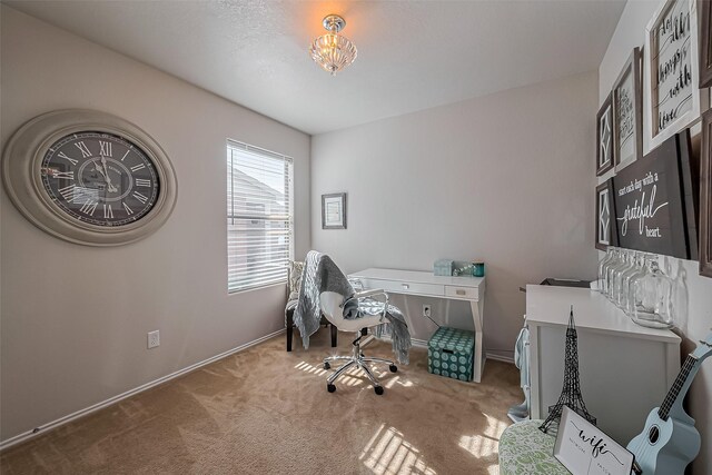 carpeted office with baseboards