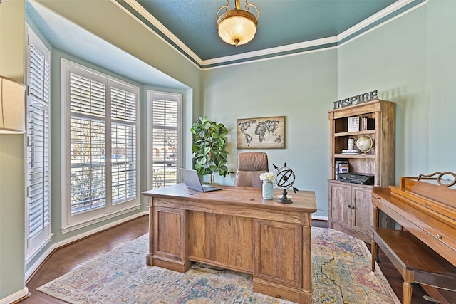 home office with crown molding, baseboards, and wood finished floors