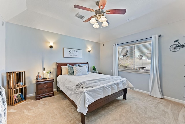 bedroom featuring visible vents, carpet floors, lofted ceiling, and baseboards