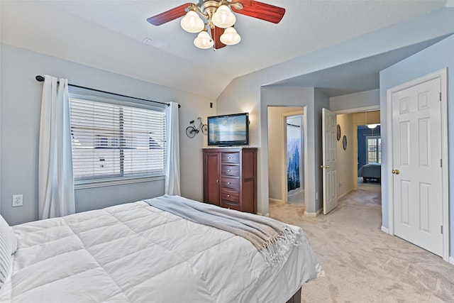 bedroom with light carpet, a ceiling fan, and lofted ceiling