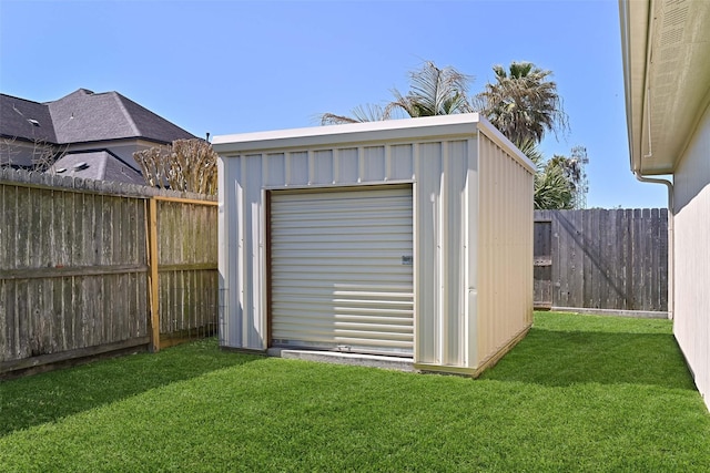 view of shed with a fenced backyard