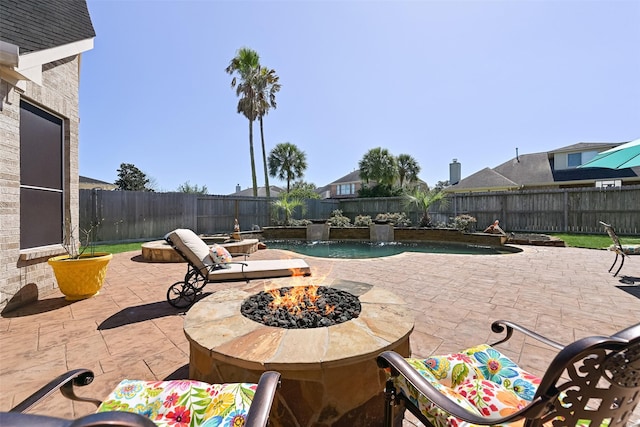 view of patio featuring a fire pit and a fenced backyard