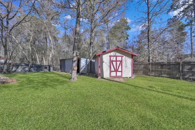 view of shed featuring a fenced backyard