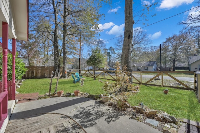 view of yard featuring a patio area and a fenced backyard