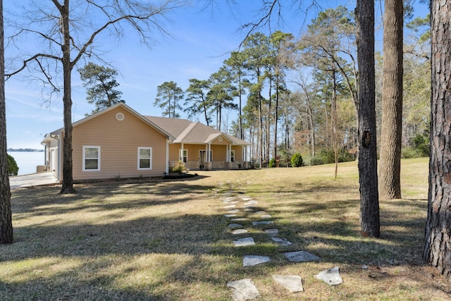 exterior space featuring a yard and covered porch