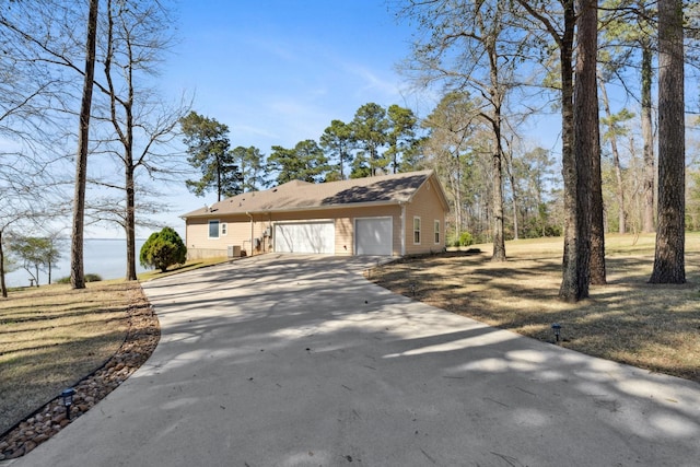 view of front of home featuring an attached garage and concrete driveway