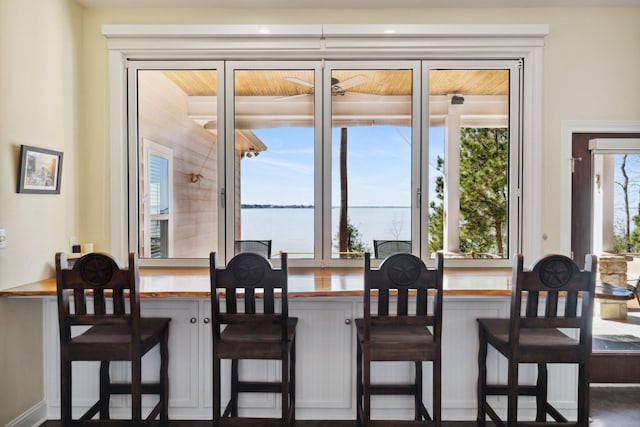 dining area featuring a water view