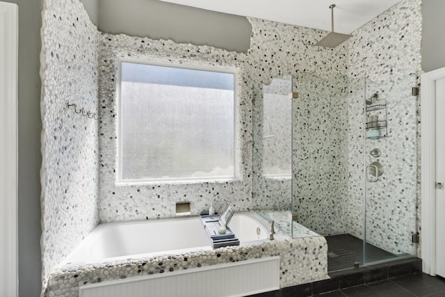 full bathroom with tile patterned floors, a garden tub, and a stall shower