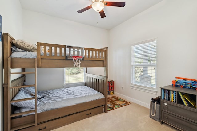 carpeted bedroom featuring baseboards