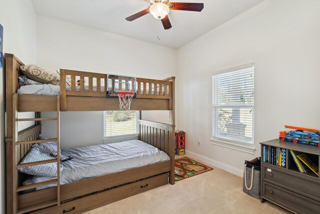 bedroom featuring baseboards and carpet