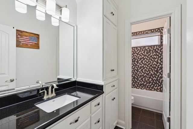 full bathroom with vanity, tile patterned floors, toilet, and shower / bathtub combination