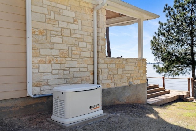 details featuring a power unit and stone siding