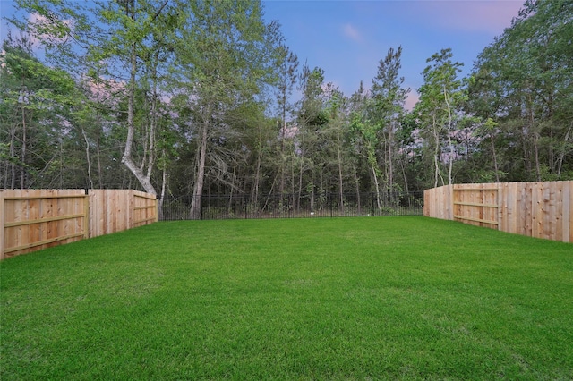 view of yard featuring a fenced backyard