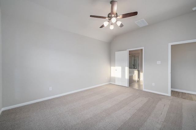 unfurnished bedroom with a ceiling fan, baseboards, visible vents, vaulted ceiling, and carpet flooring