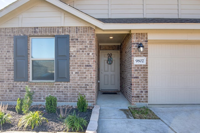 property entrance featuring brick siding