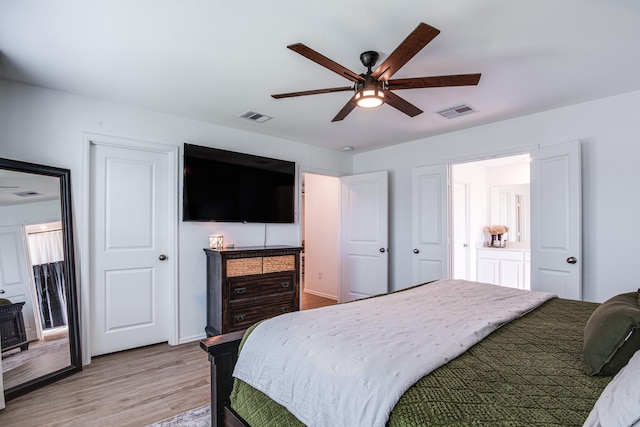 bedroom with visible vents, light wood-style floors, and ceiling fan