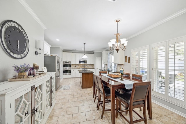 dining space with light tile patterned flooring, a notable chandelier, and ornamental molding