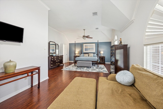 bedroom with visible vents, ornamental molding, wood finished floors, baseboards, and lofted ceiling