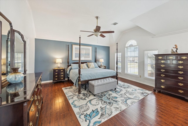 bedroom featuring vaulted ceiling, visible vents, dark wood-style flooring, and ornamental molding