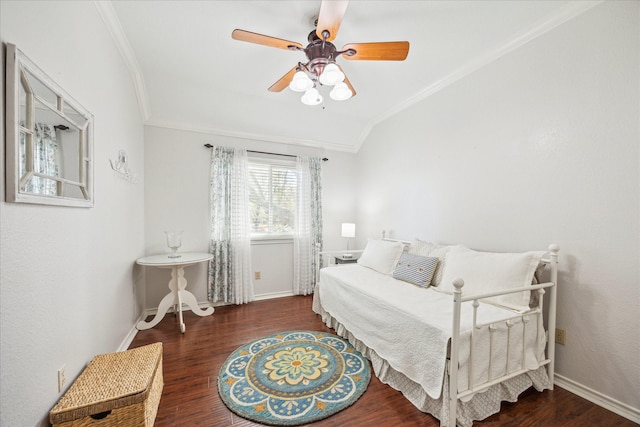 bedroom featuring vaulted ceiling, wood finished floors, baseboards, and ornamental molding