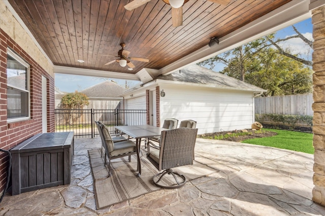 view of patio / terrace with outdoor dining area, a ceiling fan, and fence