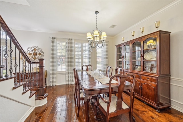 dining area with visible vents, crown molding, a chandelier, stairway, and dark wood-style flooring