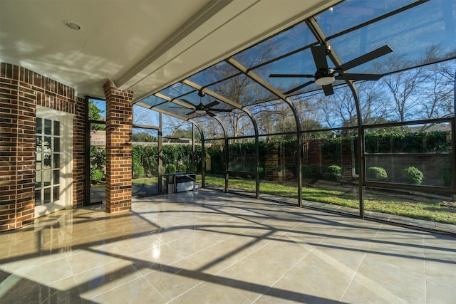 view of patio / terrace featuring a lanai and a ceiling fan