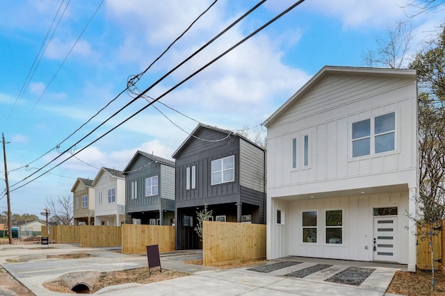 view of front of home featuring a fenced front yard and board and batten siding