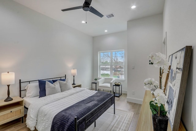 bedroom featuring recessed lighting, visible vents, light wood finished floors, and baseboards