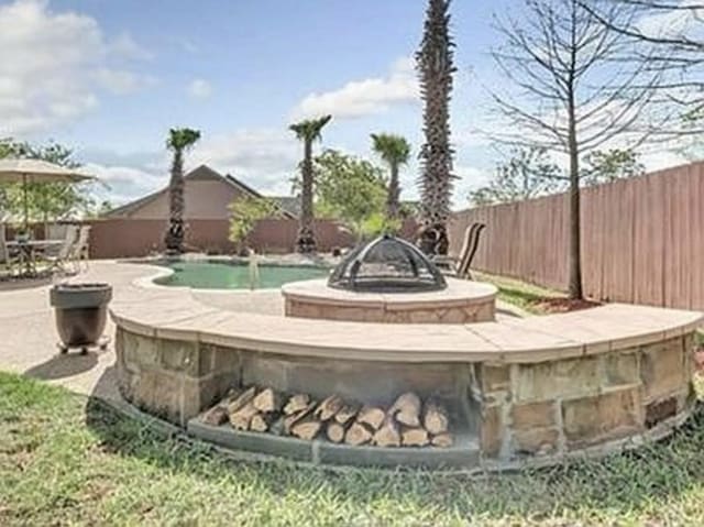 exterior space featuring a patio and fence