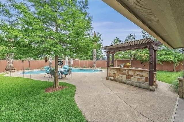 view of patio featuring a pergola, a fenced backyard, and a fenced in pool